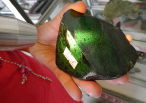 Jade rock with light shone through it to demonstrate the quality