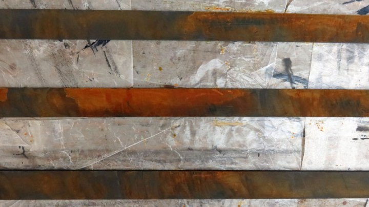 Testing iron paint & rusting solution on 3 strips of masonite